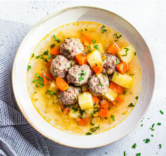 A bowl of Lemon-Dill Chicken Meatball Soup