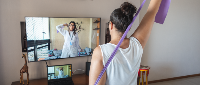 A woman learning how to relieve back joint and muscle pain.