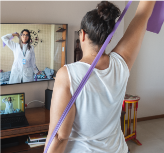 A woman learning how to relieve back joint and muscle pain.